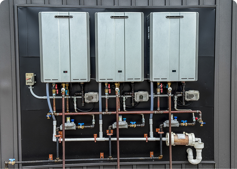 Tankless water heaters and piping system