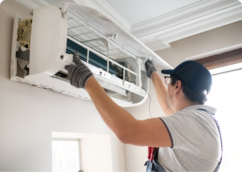 Technician repairing air conditioning unit