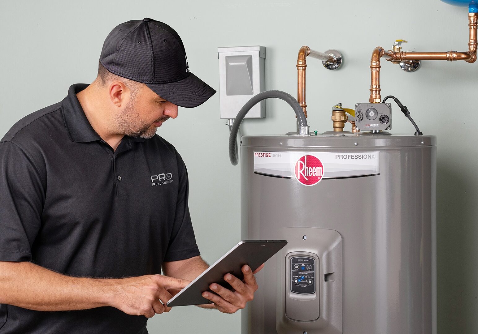 Water heater installation St. Augustine plumber installing new water heater Olympic Air water heater installation in St. Augustine FL Plumbing technician providing water heater installation in St. Johns County
